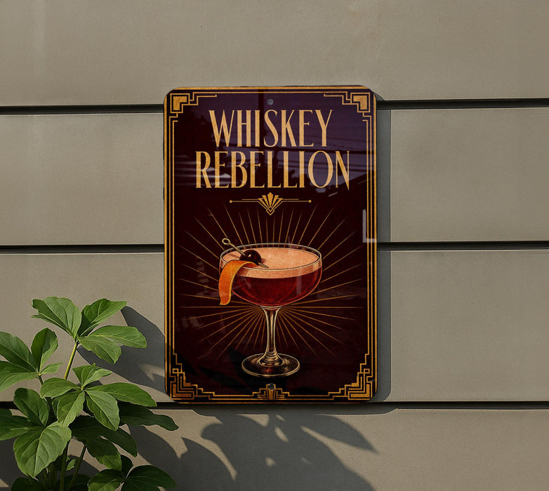 A sign that reads "Whiskey Rebellion" with an illustration of a cocktail on it, mounted on a wall.