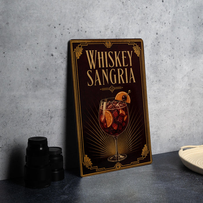 A framed poster advertising whiskey-sangria cocktails, featuring an illustration of a glass filled with a red-colored liquid and garnished with orange slices.