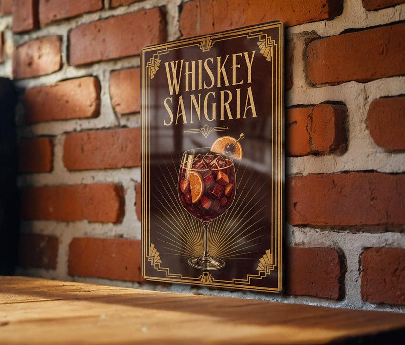 A sign for whiskey-sangria cocktail is displayed on a brick wall.