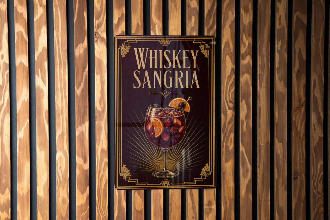 A sign for whiskey-sangria cocktail is displayed on a wooden wall.