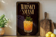 A framed advertisement for whiskey smash, featuring a glass of whiskey with a mint garnish, placed on a wooden shelf next to a cutting board and a potted plant.