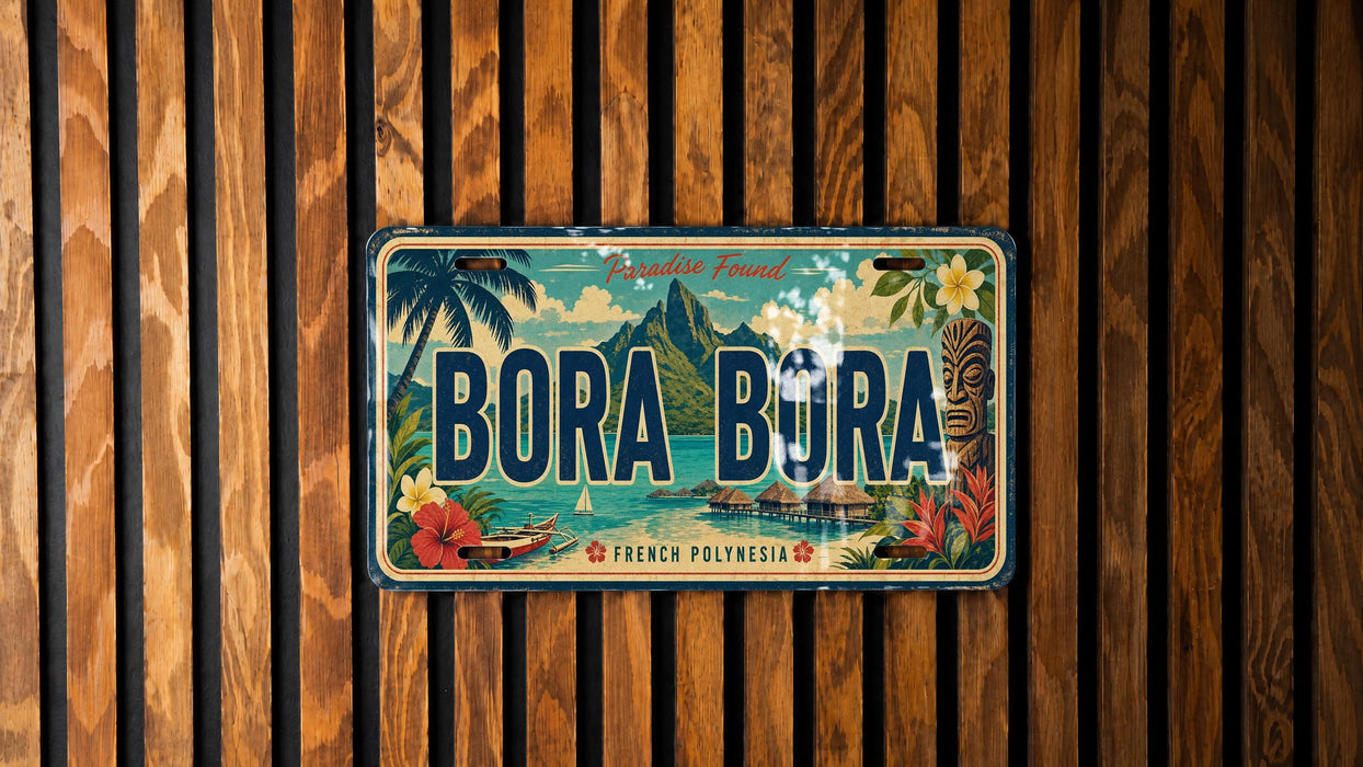 A vintage license plate with the text "BORA BORA" and tropical imagery, mounted on a wooden wall.
