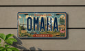 A vintage license plate from Nebraska, featuring the state's name and a graphic of a zoo.