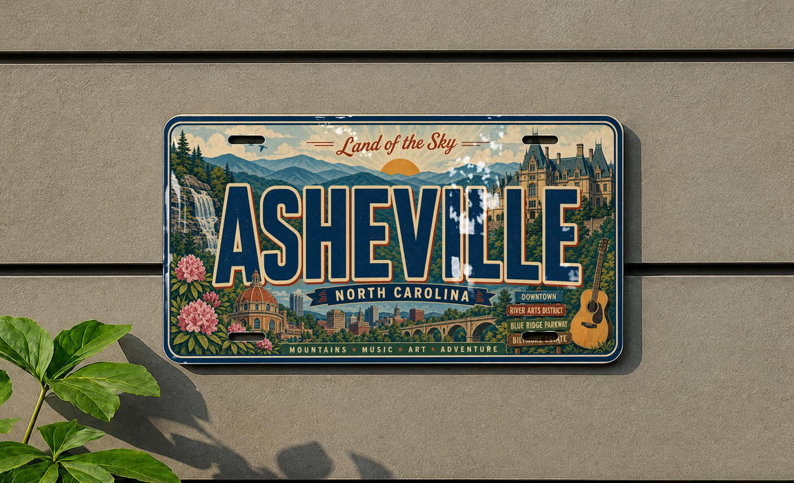 A decorative license plate from North Carolina, featuring the city of Asheville and its surrounding landscape.