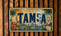 A vintage license plate from Florida's West Coast, featuring a tropical cityscape with palm trees, a sunset, and a boat on the water.
