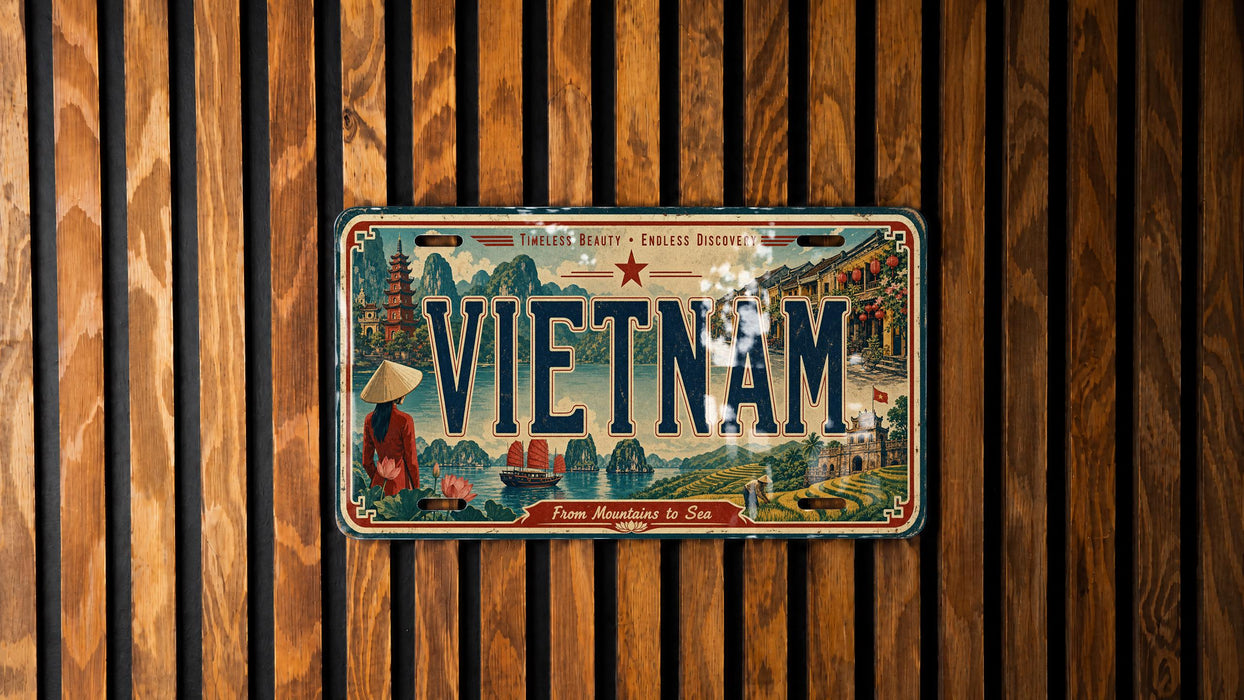 A vintage license plate from Vietnam, featuring an illustration of the country's landscape and culture, is displayed on a wooden wall.