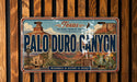 A vintage license plate from Texas, featuring the name "Palo Duro Canyon" and the state's grand canyon of texas.