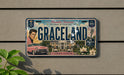 A vintage license plate from Memphis, Tennessee, featuring the iconic image of Elvis Presley and the words "Graceland" along with the year 1957.