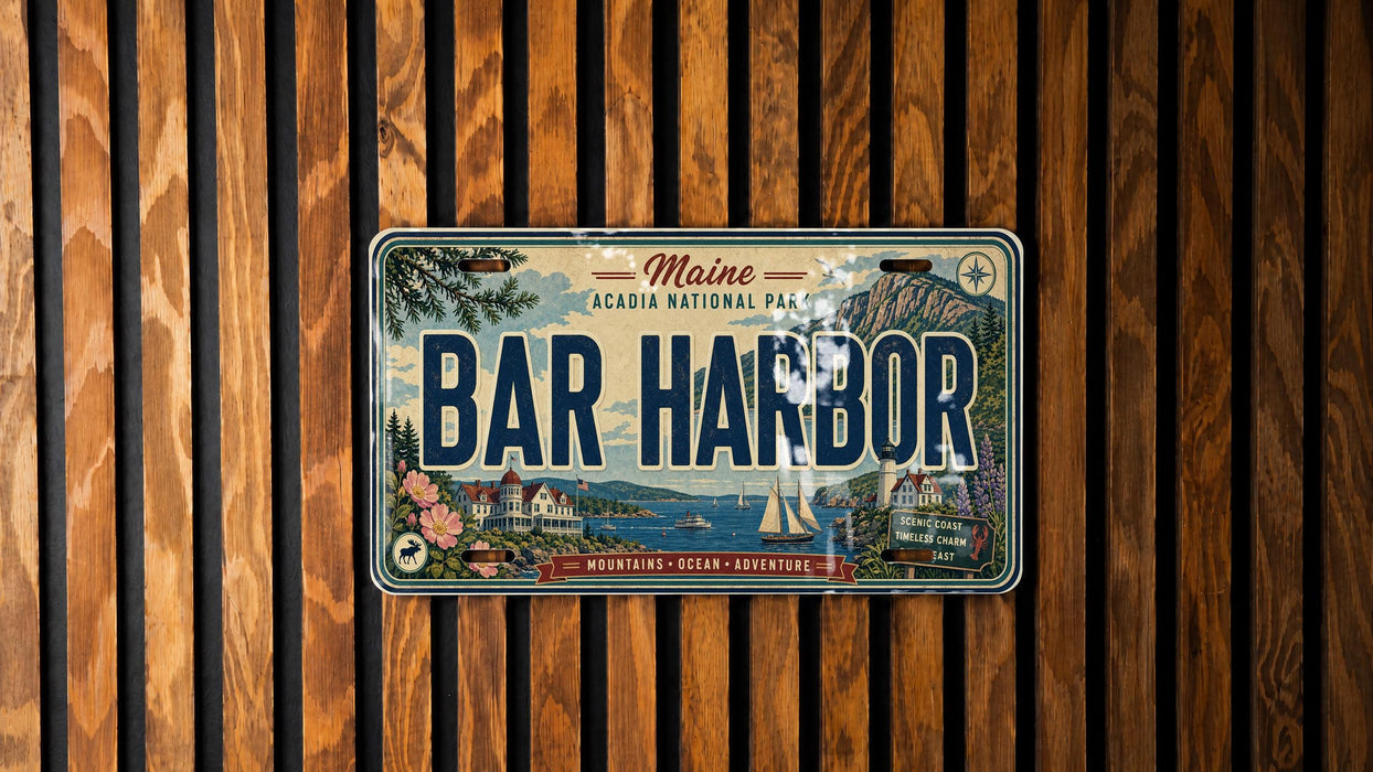 A Maine license plate with the text "BAR HARBOR" is displayed against a wooden background.