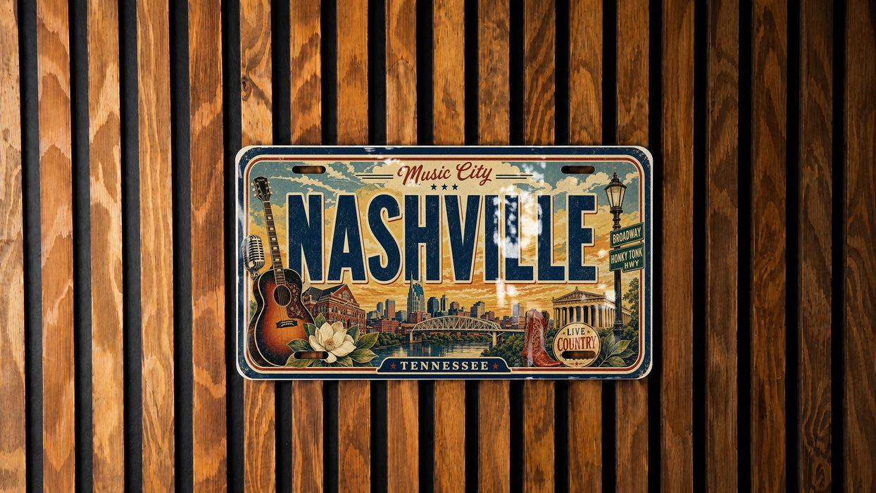 A vintage license plate from Tennessee, featuring an illustration of Nashville and its landmarks, is displayed on a wooden wall.