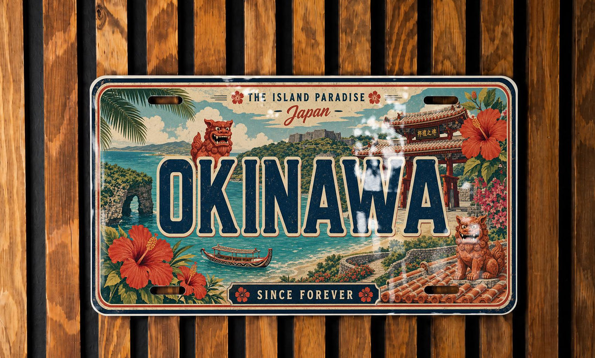 The image is a vintage license plate from Japan that features a tropical island landscape with a temple, flowers, and a lion.