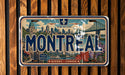 A vintage-style license plate from Montreal, Canada, featuring a cityscape and the text "MONTREAL" prominently displayed.