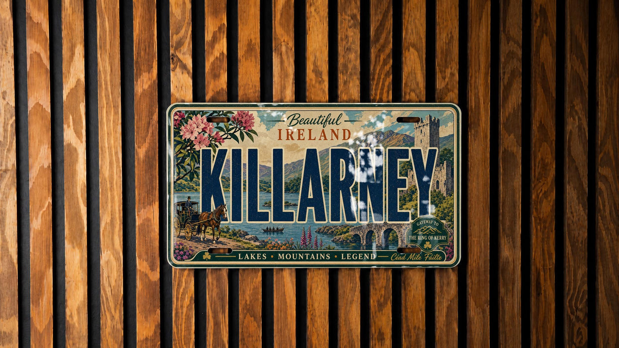 A vintage license plate from Ireland with the word "KILLARNEY" prominently displayed, hanging on a wooden wall.