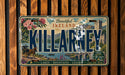 A vintage license plate from Ireland with a scenic landscape and text that reads "Beautiful Ireland" and "KILLARNEY".
