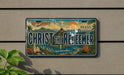 A license plate with a decorative design featuring the Christ the Redeemer statue, palm trees, and a cityscape, with the text "Rio de Janeiro, Brazil" and "Christ the Redeemer" prominently displayed.