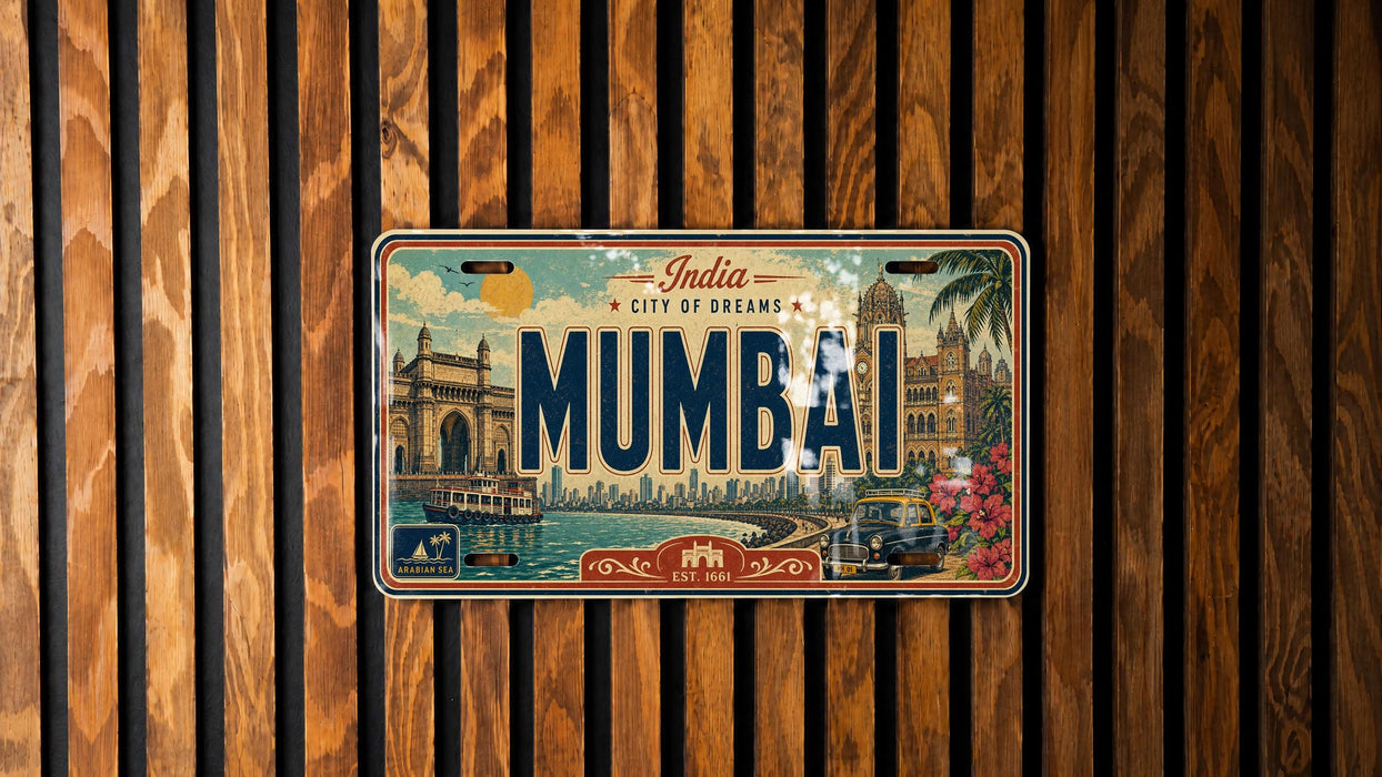 A vintage license plate from India, featuring the city of Mumbai, is displayed against a wooden background.