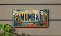 a vintage license plate with the word "MUMBAI" prominently displayed, along with various cityscape elements such as buildings, boats, and palm trees.