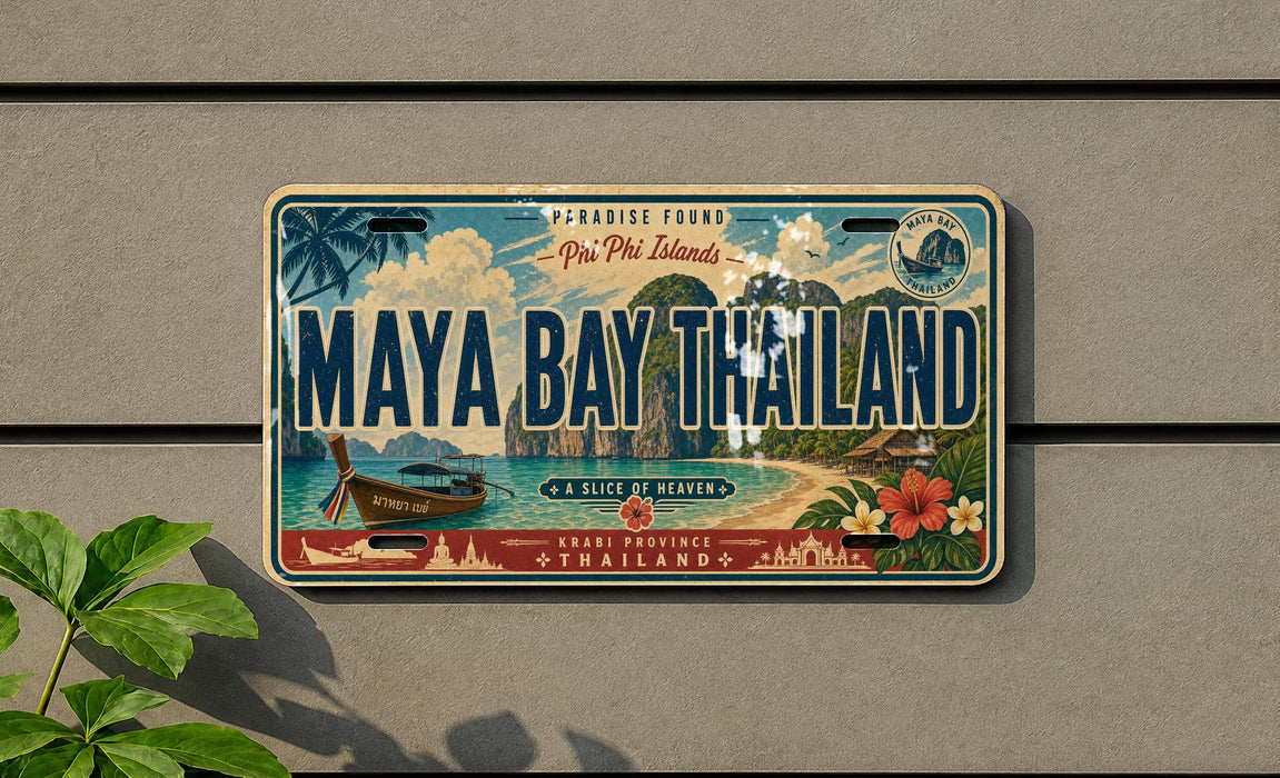A vintage-style license plate from the island of Maya Bay, Thailand, featuring a tropical landscape with palm trees, a boat, and other scenic elements.