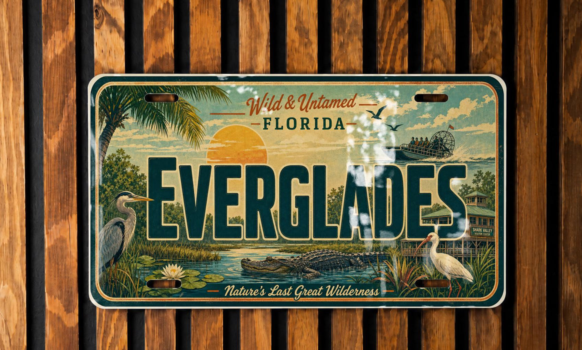 A license plate with a tropical landscape featuring palm trees, a sunset, and various wildlife, including a heron and a crocodile.