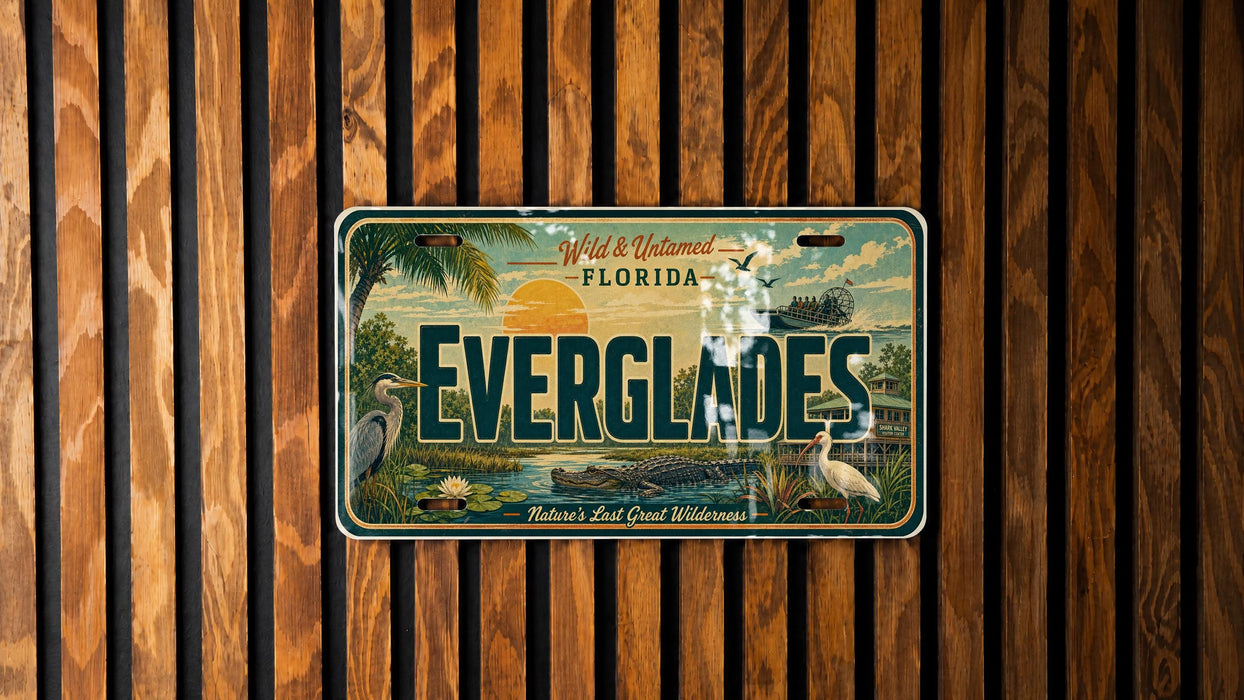 A vintage Everglades Florida license plate is displayed against a wooden background.