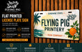 The image is an advertisement for a flat-printed license plate sign from the Flying Pig Sign Company. It features a tropical design with a pig, palm tree, and an orange, and highlights the sign's durability, high gloss finish, custom design options, and ease of hanging.