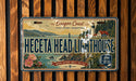 A vintage license plate from Oregon, featuring a lighthouse and coastal scenery.