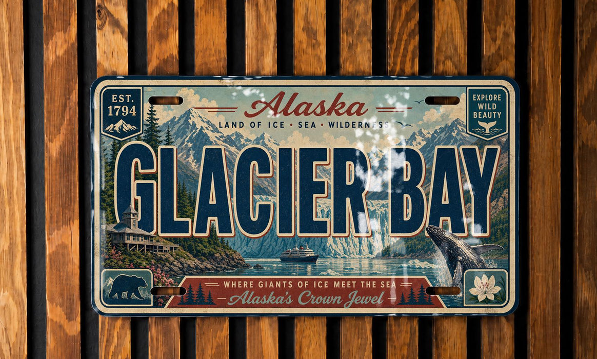 A vintage license plate from Alaska featuring the name "Glacier Bay" and a scenic image of the bay with mountains, boats, and wildlife.