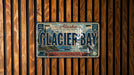 A vintage license plate from Alaska, with the text "Glacier Bay" prominently displayed.