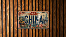 A license plate with the word "CHINA" prominently displayed, featuring various landmarks and scenes from China.