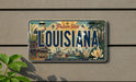 A license plate from Louisiana with a vintage design, featuring a cityscape and various landmarks.
