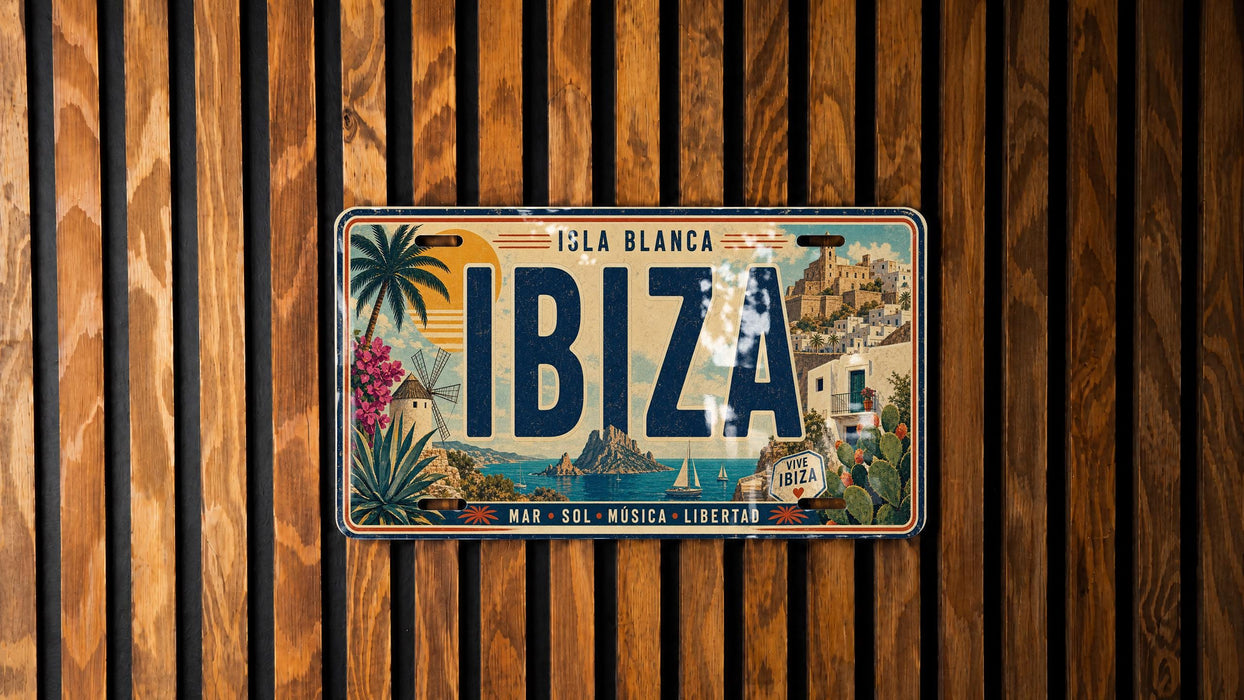 A vintage license plate from Ibiza, Spain, with a tropical island and palm trees on it, mounted on a wooden wall.