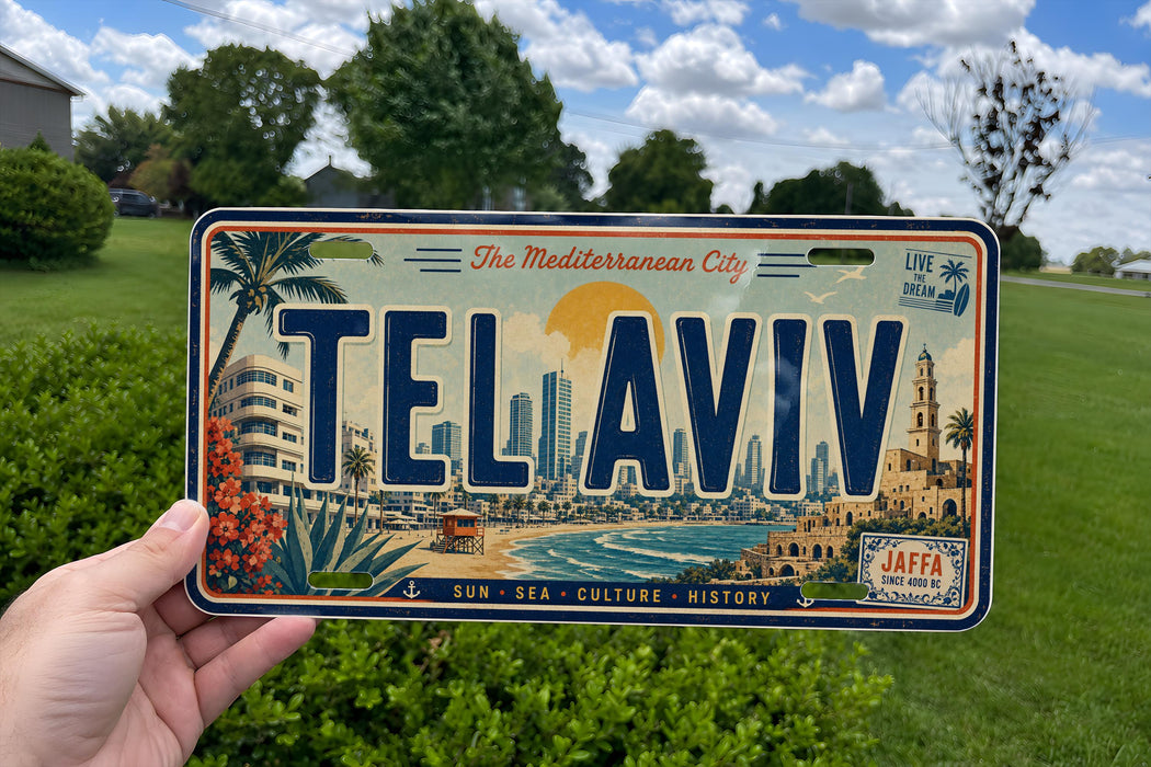 A person is holding a license plate with the word "TELAVIV" on it, which is a city license plate from Tel Aviv, Israel.