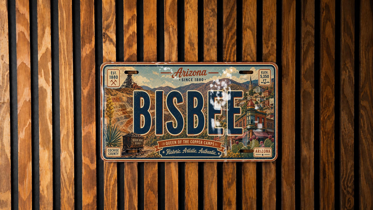 A vintage Arizona license plate with the word " Bisbee" prominently displayed, mounted on a wooden wall.